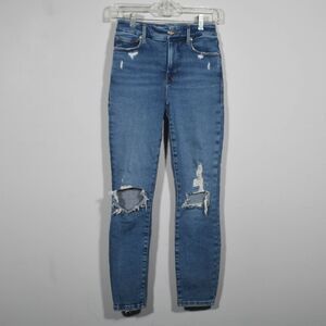 Good American Distressed Skinny Jeans in Medium Blue